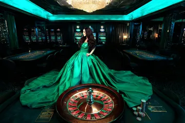 DB9 Slots — Thousands of thrilling machines await A woman smiling by bright slot machines showing lucky symbols, showcasing the exciting slot offerings at DB9.