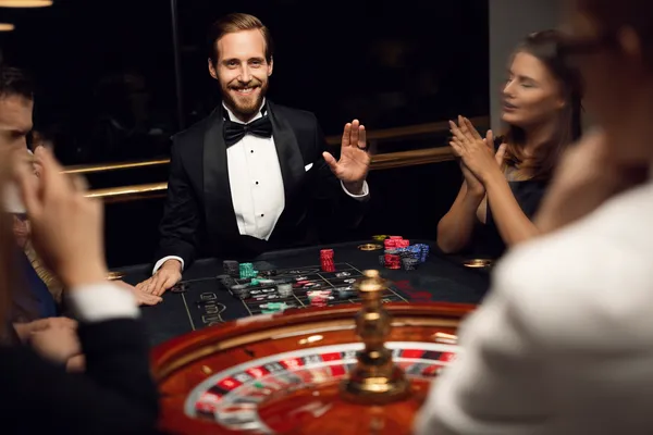 DB9 Login — Instantly access your secure account A confident dealer surrounded by casino chips inviting players to access their DB9 account, reflecting quick and easy login options.